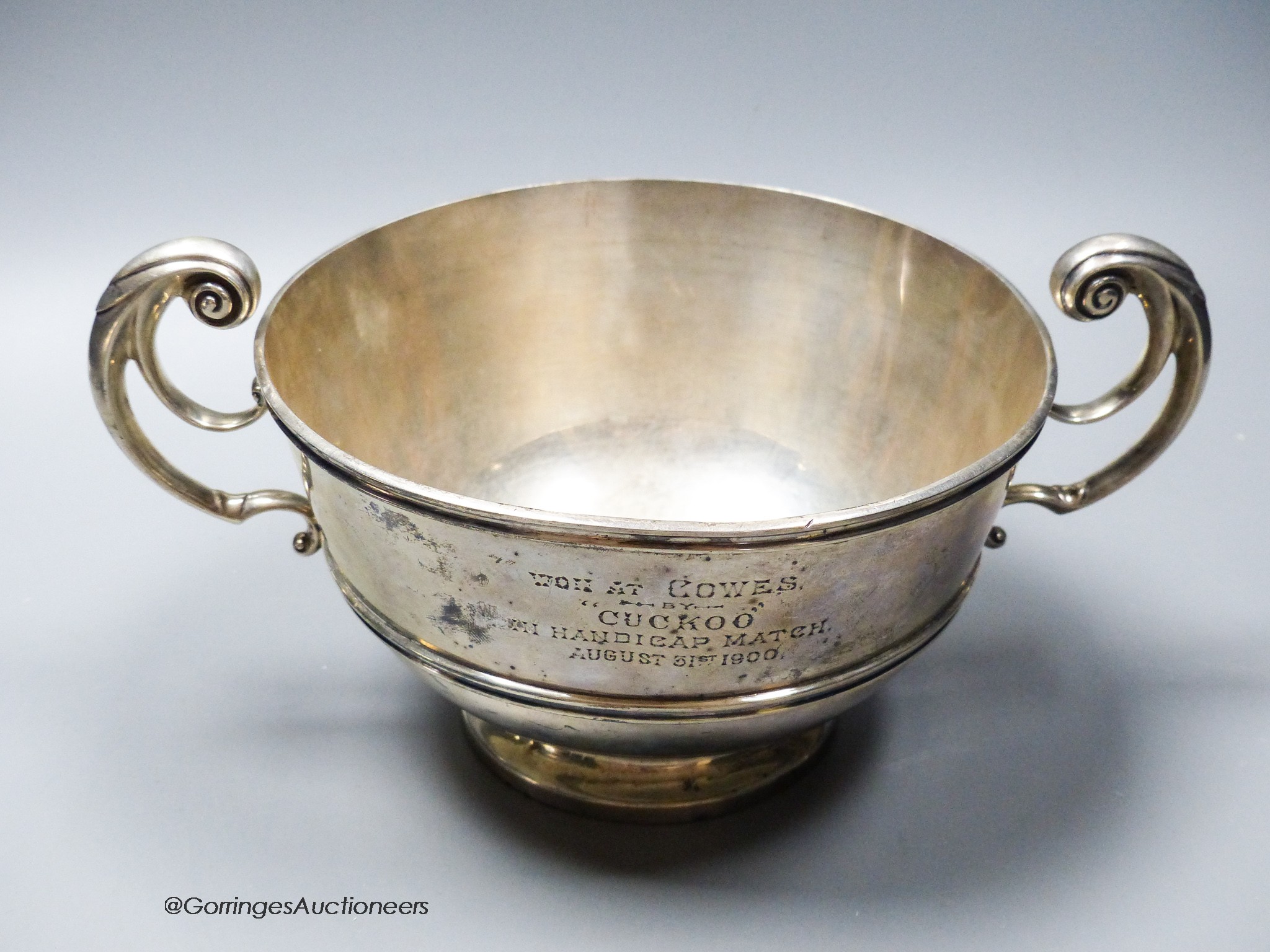 A late Victorian silver two handled presentation bowl, with Cowes, Isle of Wight related inscription, Charles Stuart Harris, London, 1898, diameter 18cm, 21.5oz.
